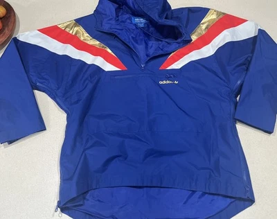 Jaqueta corta-vento Adidas 1/4 zíper metálica dourada azul vermelha branca masculina média olímpica - Imagem 1 de 4