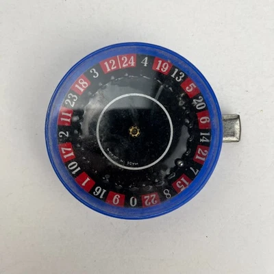 Juguete de ruleta miniatura vintage de plástico tamaño bolsillo - 2 1/2" Foto 1 de 3
