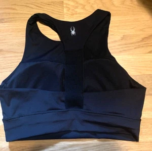 Sujetador deportivo activo Spyder L negro espalda deportiva copas extraíbles elástico en 4 vías nuevo sin etiquetas - Imagen 1 de 3