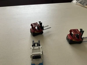 1/64 Scale Three Matchbox Fork Lifts, 2 Red & 1 White/blue - Picture 1 of 2