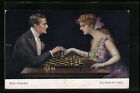 Künstler-AK Ruab Gnischaf: Schachspiel, elegantes Paar spielt Schach, Chess 
