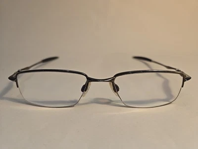 Broca Oakley OX3143-0251 0,5 anteojos peltre 51-18-136 media llanta, titanio Foto 1 de 4