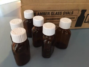 LOT OF 6  AMBER  1 OZ  GLASS  LIQUID MEDICINE BOTTLES WITH SAFETY TOPS BRAND NEW - Picture 1 of 4