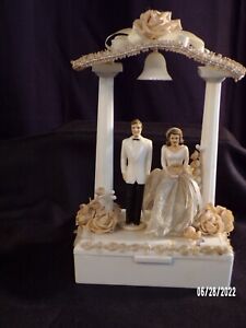 vintage wedding cake topper over keepsake box