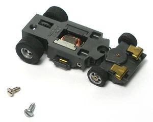 1 Stück 1976 Aurora AFX MAGNA-LENKUNG HO Slotcar Chassis UNBENUTZT Screecher V.Quick! - Bild 1 von 3