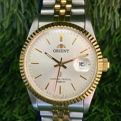 Reloj de cuarzo raro ORIENT UR9D-B0 cristal de zafiro fecha esfera plateada dos tonos para hombre Foto 1 de 4