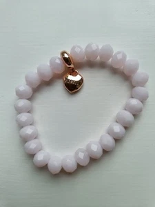 Pink FIORELLI beaded bracelet with rose gold love heart printed ‘FIORELLI’ - Picture 1 of 3