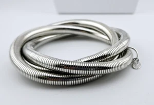 Kirks Folly Twist and Turn Silver Tone Stretch Bangle Bracelet - Picture 1 of 4