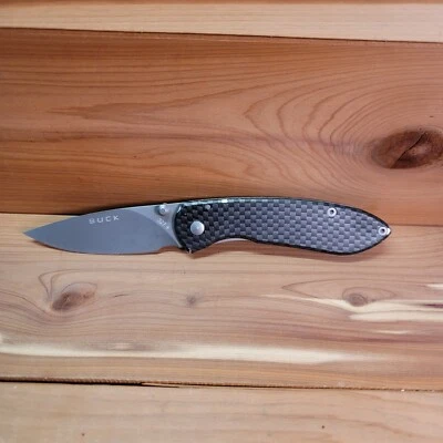 Navaja de bolsillo Buck 327 Nobleman de acero inoxidable con clip para cinturón mango a cuadros EDC Foto 1 de 4