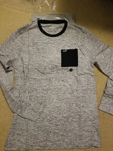 Nueva con etiquetas Camiseta Hollister Mangas Largas Bolsillo Algodón Gris/Negro M o L - Imagen 1 de 2