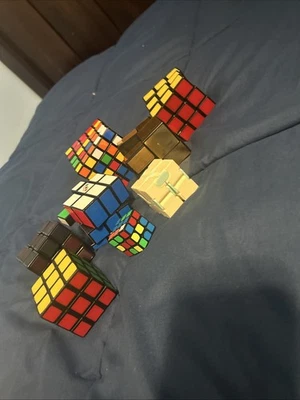 Unsolved Rubrics Cubes Set Of 8 And The One With Dark Color Is Thermal - Image 1 of 4