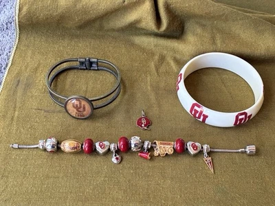 THREE (3) UNIVERSITY OF OKLAHOMA BRACELETS (1 BGE) & ONE (1) EXTRA CHARM~GREAT - Image 1 of 4