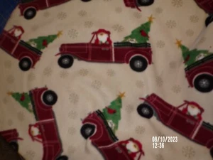 Santa in Red Pickup Truck on Cream Anti Pill Fleece Fabric - 1.5 yds x 60" - Picture 1 of 1