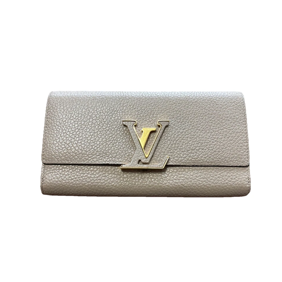 Louis Vuitton Capucines wallet made of textured leather. - Image 1 of 4