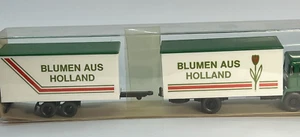 C 134 - Camion MAN Lastzug mit Tandemanhänger WIKING 24 426 BLUMEN AUS HOLLAND - Foto 1 di 10