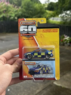2012 Matchbox 60th Anniversary Mitsubishi Lancer Evolution X Police - Image 1 of 4