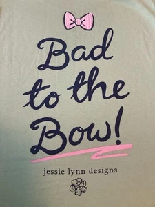Jessie Lynn Designs 'Bad to the Bow' Women's T-Shirt NEW - Picture 1 of 5