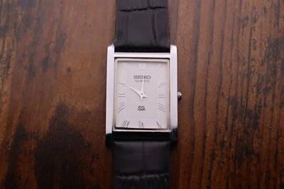 Vintage Men Seiko Quartz Slim Tank  White Dial Black leather Dress Watch - Image 1 of 4