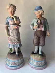 Par de estatuas grandes antiguas francesas de porcelana bisque niño niña - Imagen 1 de 24