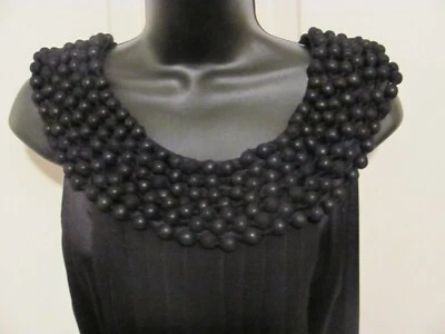 TOP FEMININO LEON MAX EDIÇÃO LIMITADA PRETO COBERTO COM MIÇANGAS SEM MANGAS TAMANHO 10 - Imagem 1 de 4