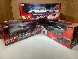 JOYRIDE 1:18 JAMES BOND TRIPLE SET ASTON MARTIN DBS DB5 CORVETTE GOLDFINGER RARE - Picture 1 of 23