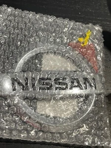 New Genuine Nissan Emblem 84890-1DA0B - Picture 1 of 2