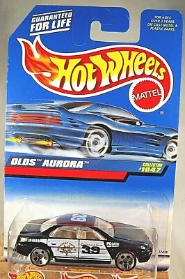 Hot Wheels Mainline/Collector #1047 Olds Aurora 1998 negro con radios cromados de 5 puntos Foto 1 de 4