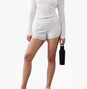 Pantaloncini corti 4" Athleta Mid Rise Mesh Racer Run nuovi con etichette 3X bianchi - Foto 1 di 7