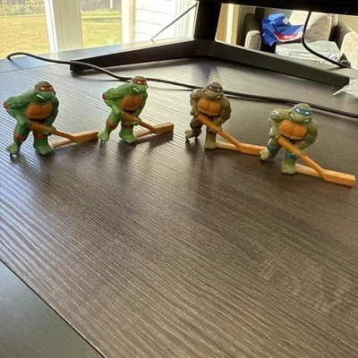 1990 TMNT  Sewer Hockey Figures (4) Raphael Leonardo Donatello Michelangelo - Image 1 of 4
