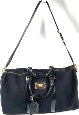 Bolso de mano de viaje Victoria's Secret negro de lona y cuero para fin de semana Foto 1 de 4