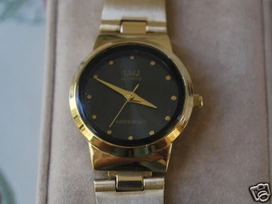 New Q&Q by Citizen Gold Tone Lady Dress Watch w/Black Dial - Picture 1 of 7
