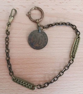 Antike schöne Taschenuhrenkette goldfarben m. Anhänger Münze  - Bild 1 von 3