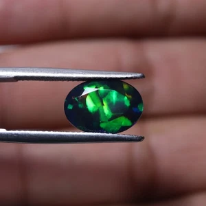 2,9 kt 12,5 x 8,9 mm natürlicher AAA auffälliger Regenbogen Feuer geräuchert schwarzer äthiopischer Opal - Bild 1 von 9