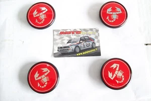 KIT 4 BORCHIE COPRIMOZZO A112 ABARTH LANCIA DELTA EVOLUZIONE COPPA RUOTA 55 mm - Picture 1 of 3