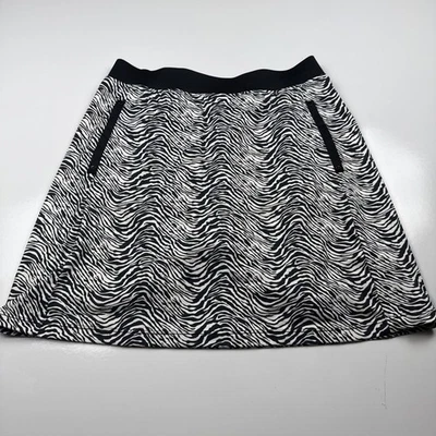 Falda corta con volantes de tenis y golf Tail para mujer de 3 bolsillos pequeña en blanco y negro estampado de cebra Foto 1 de 4