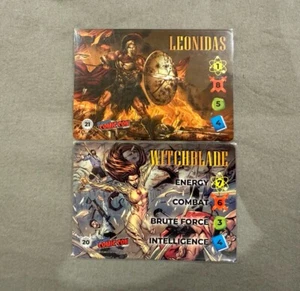 Overpower Card Game CCG Leonidas & Witchblade Stamp Promo Set NYCC 2024 - Foto 1 di 5