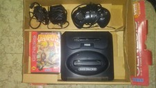 Vintage sega genesis core system in box with eternal champions video game.