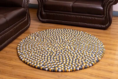 Add a Pop of Color with our Handmade Multi-Colored Round Felt Ball Rugs - Image 1 of 4