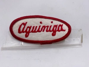AGUINIGA GEBRAUCHT BESTICKT AUFNÄHEN NAMEN PATCH ETIKETTEN OVAL ROT AUF WEISS - Bild 1 von 1