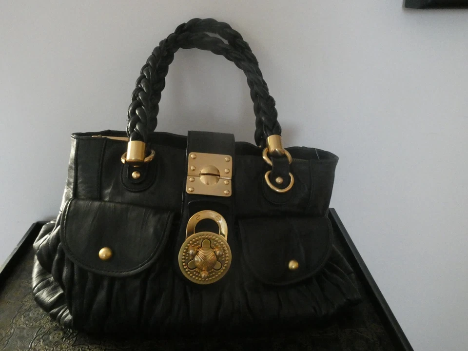 Bolso de hombro Steven by Steve Madden para mujer de cuero genuino negro dorado cierre giratorio Foto 1 de 4