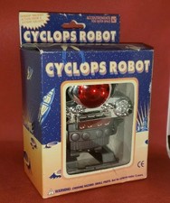 1995 Vintage ACCOUTREMENTS CYCLOPS ROBOT Wind up Silver Plastic Toy w/ Box 
