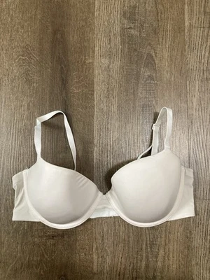 Camiseta sujetador con aros DKNY para mujer beige claro talla 34D  Foto 1 de 4