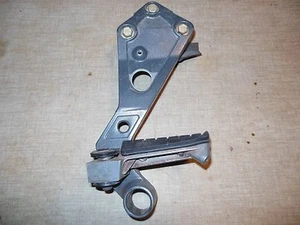 95 Triumph Sprint 900 left rear passenger foot peg rest + mount bracket + bolts - Picture 1 of 4