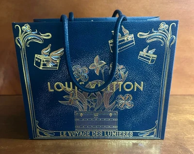 Louis Vuitton LV 2025 edición navideña pequeña bolsa de regalo de compras azul dorado nueva Foto 1 de 3