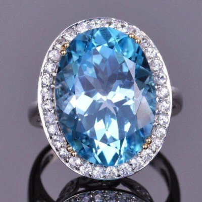 Anillo de compromiso halo acabado oro blanco de 14 quilates aguamarina y diamantes talla ovalada de 3,70 quilates Foto 1 de 3