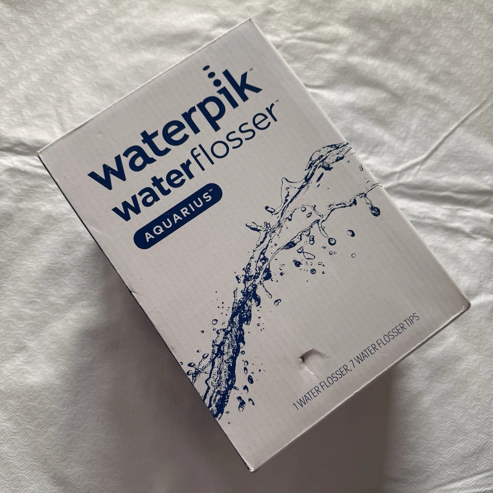 Waterpik Water Flosser Aquarius WP-660C - Blanco - NUEVO con puntas  Foto 1 de 3