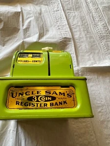 Registro 3 monete vintage dello Zio Sam banca verde Western Stamping Corp. - Foto 1 di 1