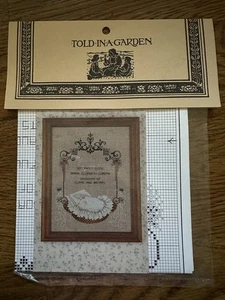 Told In A Garden BABY IN A BASKET Counted Cross Stitch Pattern NEW - Picture 1 of 3