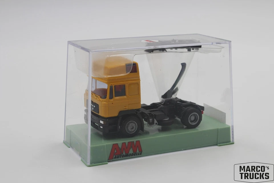 AWM MAN F2000 Evo tractor unit 4x2 2-axle yellow 6839.01 1:87 /AWN81 - Image 1 of 1