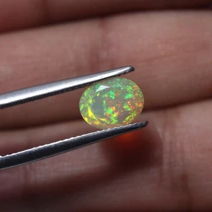 7x9 MM Oval Cut 1.3 Cts Natural AAA Green Yellow Red Fire Faceted Ethiopian Opal - Picture 1 of 10